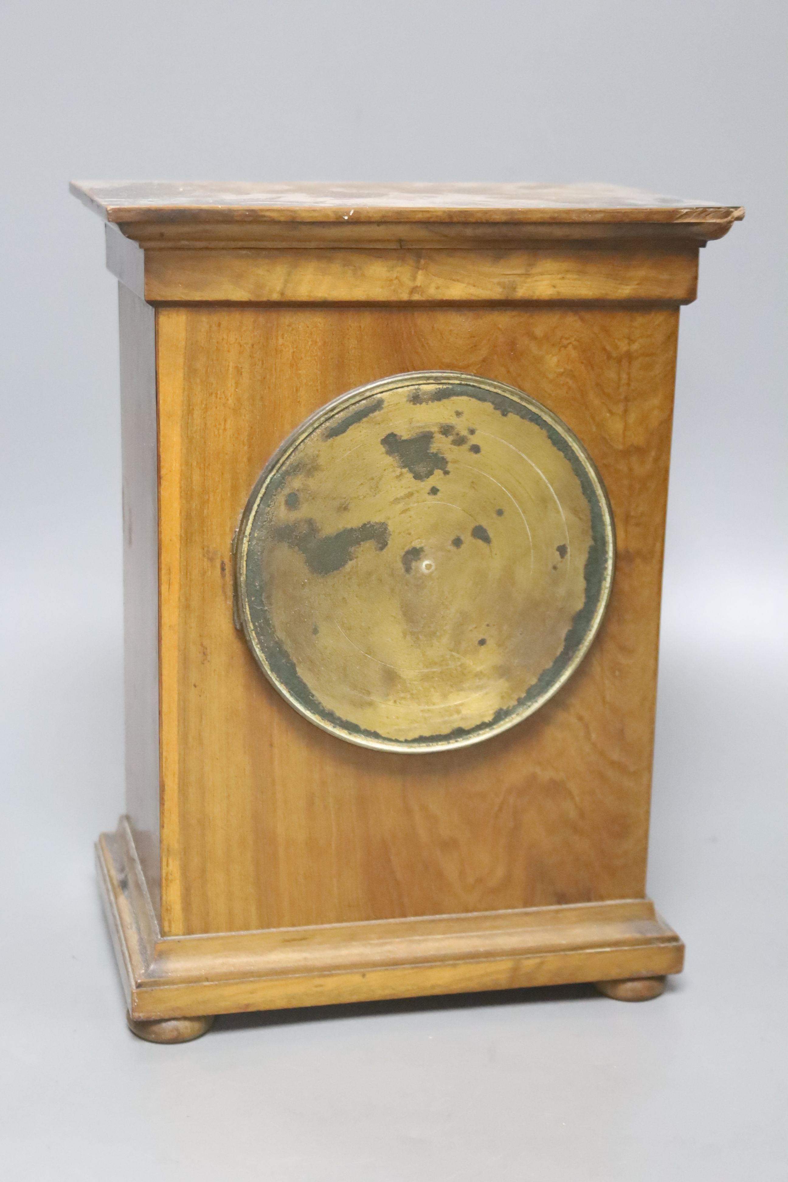 An Edwardian walnut mantel clock, with decorative dial, height 26cm